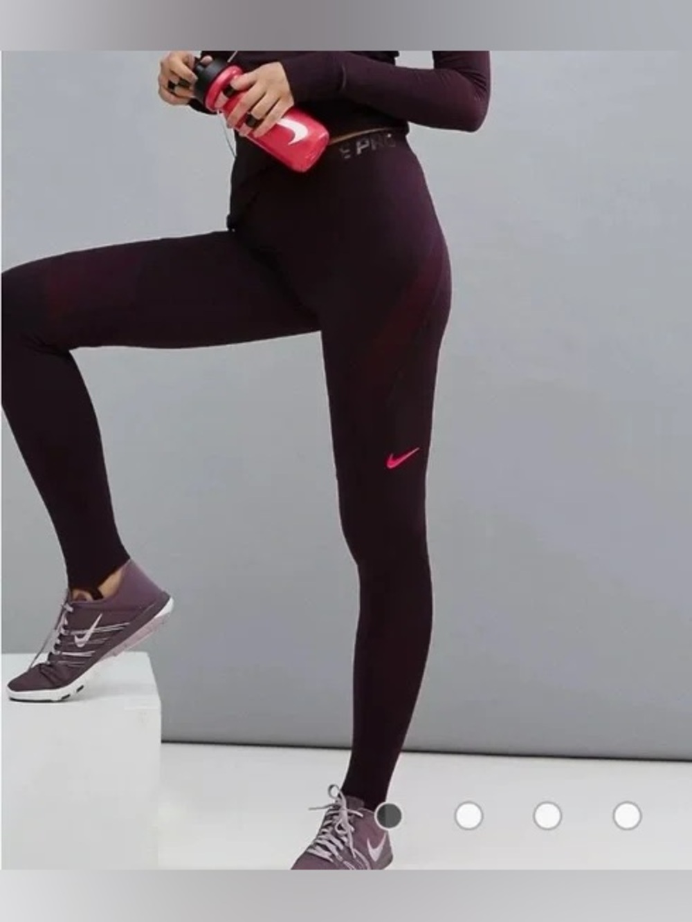 Nike Pro Purple Hyperwarm training tights with pink logo.